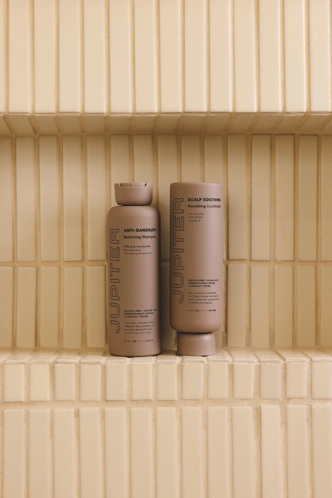 shampoo and conditioner bottles in shower